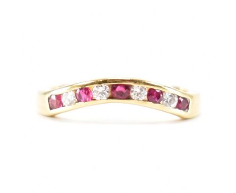 An 18ct gold ruby and diamond channel set ring. The ring being set with five round cut rubies and four round cut diamonds. Ha