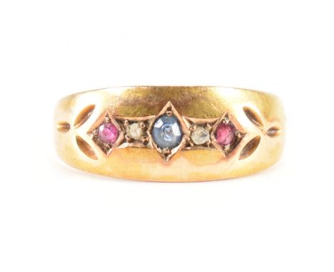 A 19th Century Victorian 15ct gold sapphire, diamond and ruby ring. The ring being set with a central round cut sapphire flan