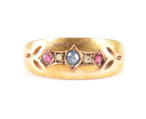 A 19th Century Victorian 15ct gold sapphire, diamond and ruby ring. The ring being set with a central round cut sapphire flan