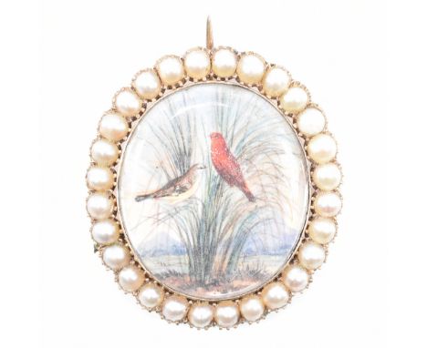 A Georgian antique gold and half pearl miniature brooch. The brooch having an oval panel to the centre painted with two perch
