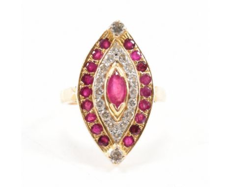 A&nbsp; hallmarked 14ct gold ruby and diamond panel ring. The ring set with a marquise cut ruby framed by round brilliant cut