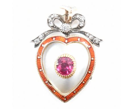 A 19th Century Victorian, ruby, diamond and mother of pearl heart pendant. The pendant being set with a oval cut ruby to the 