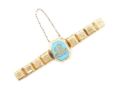 A 19th Century gold enamel locket panel bracelet. The bracelet with a central enameled monogram locket with mourning hairwork