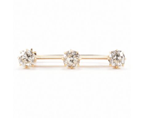 1920s gold diamond bar brooch pin. The brooch set with old cut diamonds to knife bar having roller clasp verso. Gold unmarked