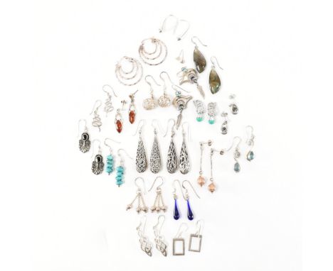 An assorted collection of 925 silver earrings. The lot to include; twist hoop earrings with hinge clasps, knotted drop earrin