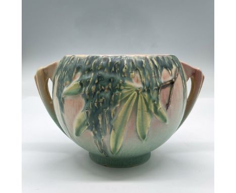 This pink- turquoise planter features impressed marks and dripping green glaze hanging from long leafed branches. Marked Rose