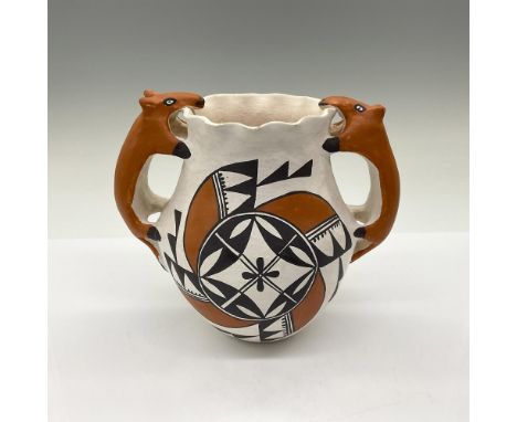 This hand-built double-handled vase features animal-shaped figural handles. Created by award-winning Acoma potter Melissa Ant