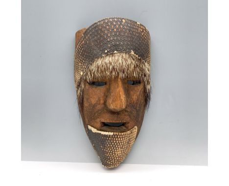 Carved decorative folk art mask adorned with armadillo armor and porcupine quills. Issued: 20th centuryDimensions: 6.75"L x 3