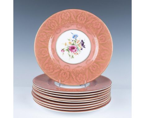 Beautiful set of elegant porcelain dinner plates. Each features a pink color design with a gold ornate pattern and a floral c