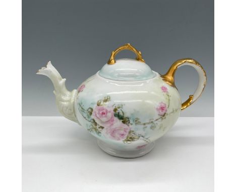 Delicate design of pink flowers with green vines designed over white porcelain. Gilt accents on spout, handle and cover. T &a