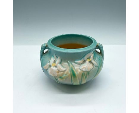 Light blue glaze with raised iris pattern colored in peach with green leaves. Roseville impressed mark. 647. Issued: 20th cen