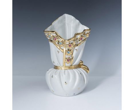 Exquisitely detailed figure designed with Swarovski crystals and gilt accents on draped styled vase with large gilt bow. RG i