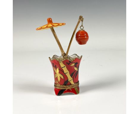 Hand painted, vase shaped porcelain treasure box adorned with an umbrella in beautiful orange red and gold color with bamboo 