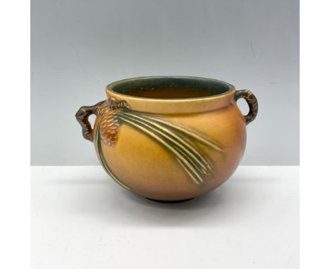 Splendid planter with small rounded handles and a mold design that incorporates leaves and cones. Roseville backstamp. Issued