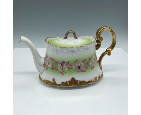 Exquisite hand painted design in pink, white and purple over white porcelain with light green banding. Gilt accents on spout,