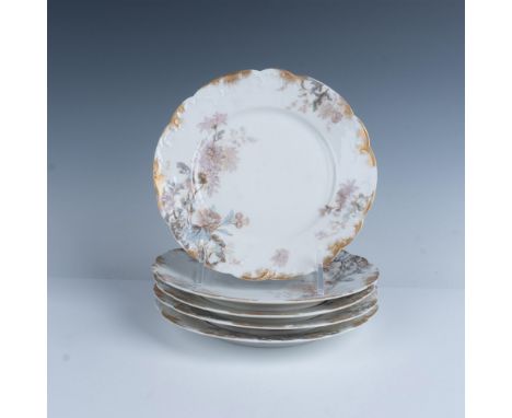 Elegant porcelain plates with scalloped edges, decorated with a floral design and embellished with gold daubs. Haviland &amp;