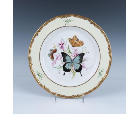 A lovely gilded porcelain plate depicting a Blue Mountain Swallowtail butterfly with two other butterflies perched on flowers