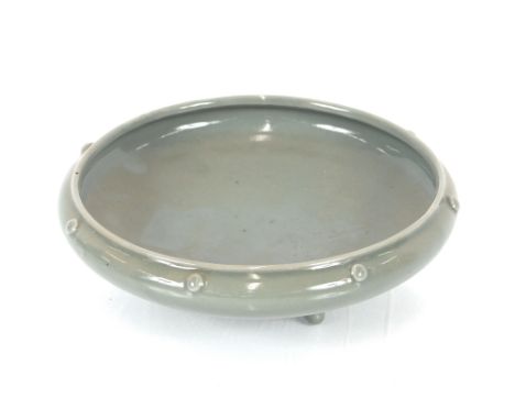 A Ming Dynasty green glazed bowl with comb decoration, 16.5cm dia.; a green / grey glazed 18th Century Chinese censor raised 