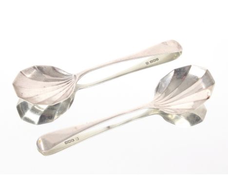A pair of George V silver serving spoons, Sheffield 1929; a cased set of plated cake forks with twist handles; a cased set of