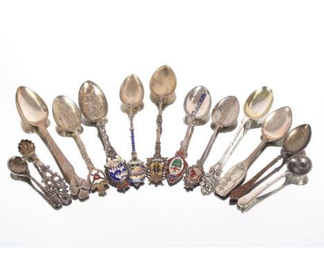 A small modern silver caddy spoon; a pair of Georgian silver sugar tongs; various silver spoons; an engine turned silver ciga