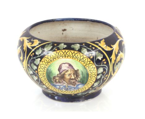 A 19th Century Italian pottery jardinière, having brightly coloured floral decoration around central portrait panels, 33cm di