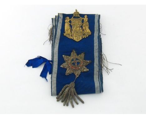 A sash of office, probably from a Victorian Friendly Society, blue with grey edges and silver braid, a white rosette to rever
