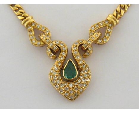 An emerald and diamond pendant, the central pear cut emerald approx. 0.41 carat, rub over set in a pave set double-scroll sur