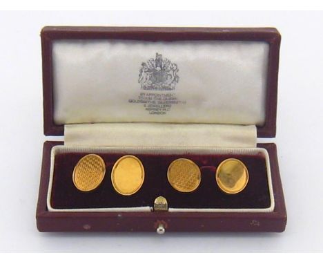 A pair of 18 carat gold cuff links by Asprey, hallmarked Birmingham 1989, the oval engine turned links signed verso, 14.5 gms