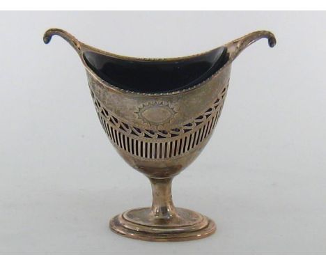 A silver sugar vase by T. Bradbury, Sheffield, 1910, helmet form with turned over scroll ends, sides pierced with band of vit