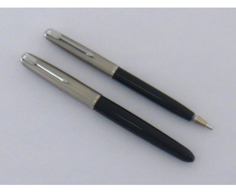 A mid 20th century Parker 51 fountain pen and pencil set, with black barrels (personalised) and brushed steel caps, in Parker