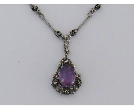 A Jugenstil silver and amethyst necklace, circa 1900, the centre piece claw set with an oval cut stone approx. 18.25 carats, 