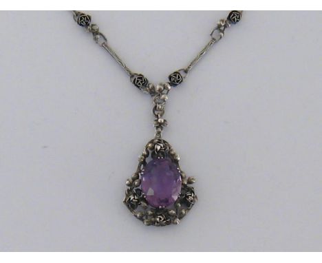 A Jugenstil silver and amethyst necklace, circa 1900, the centre piece claw set with an oval cut stone approx. 18.25 carats, 