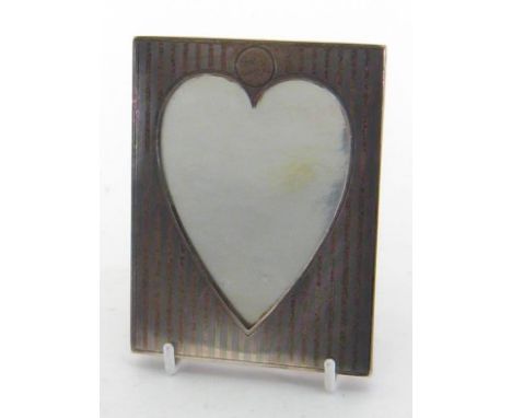 A small Canadian silver photograph frame by Birks, circa 1930, oblong, engine-turned with alternate reeded bands and plain st