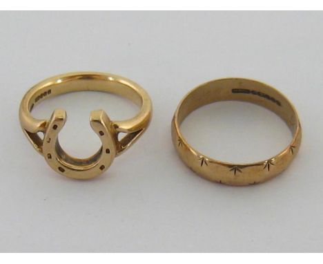 Two 9 carat gold rings, the first designed with a horse shoe bezel, finger size L/M, the second a chased band, finger size N/