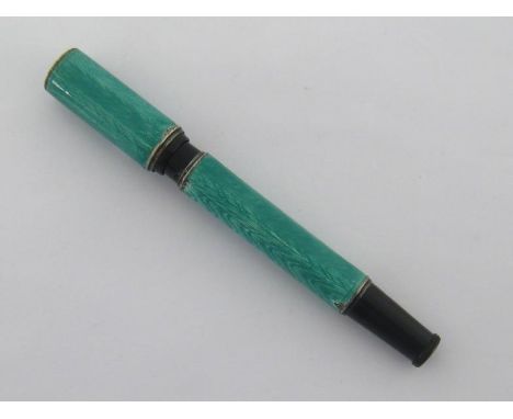 An Art Deco silver, enamel and black resin safety pen by Montblanc, the mint green guilloche enamel and silver jeweller's ove