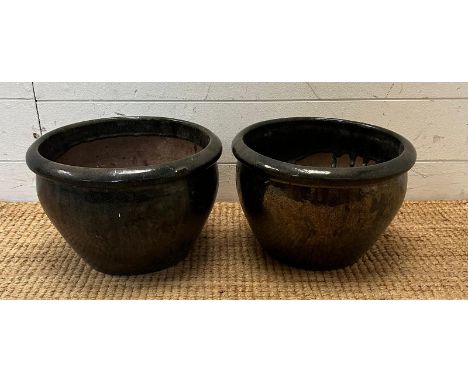 A pair of dark green glazed garden planter 