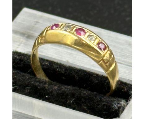 An 18ct gold diamond and ruby ring, Birmingham hallmark. Approximate total weight 2.5g
