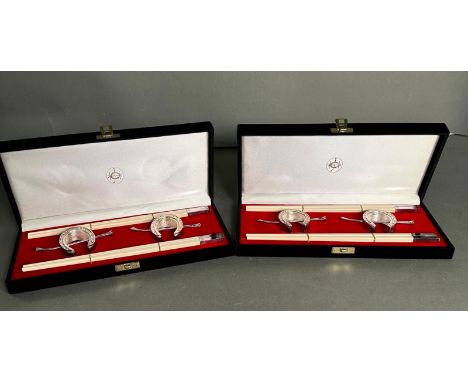 Two boxed set of chopsticks with silver plated horseshow and jockey whip shaped rests from the Hong Kong Jockey club