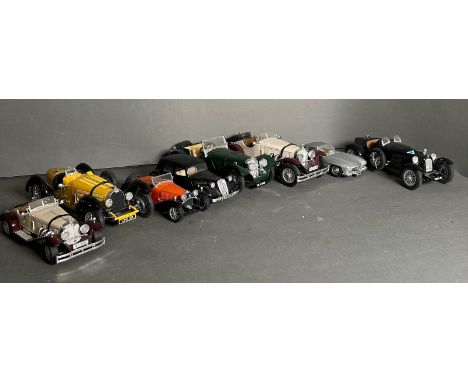 A selection of unboxed Burago Diecast vehicles to include a Citroen J.A 15, a Bugatti type 55 and a Mercedes Gullwing 