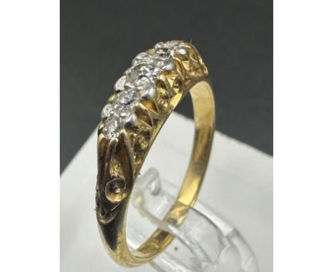 A three stone diamond ring on 18ct gold, with an approximate weight of 3.1g and size M