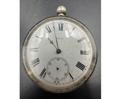 A fine silver pocket watch with enamel face and roman numerals 