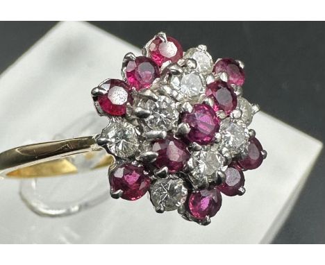 An 18ct gold ruby and diamond ring, size O