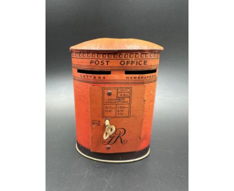 A vintage Chad Valley money box in the form of a post box