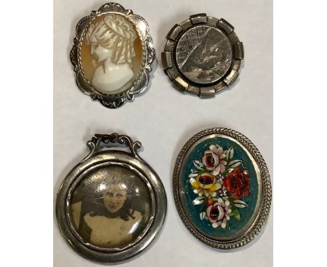 A Victoria silver brooch; a silver cameo; a silver portrait locket; a micro-mosaic brooch