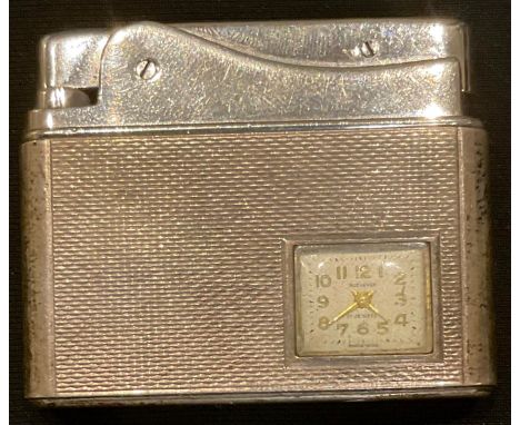 A silver combination purse watch and cigarette lighter 