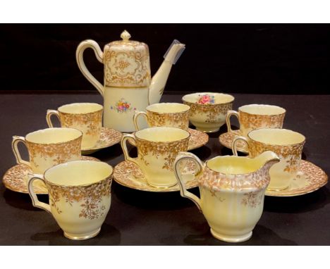 A Crown Staffordshire coffee set for six, comprising coffee pot, cream jug and sugar bowl, six coffee cups and saucers, spare