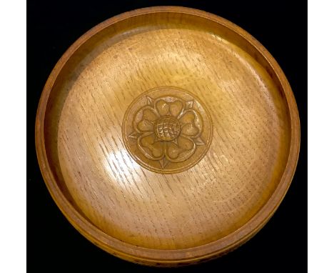 An oak fruit bowl, in the manner of Mouseman and the Yorkshire Critters, carved to the centre with a Yorkshire rose, 21cm dia