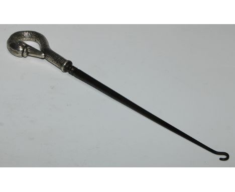 A late Victorian silver coloured metal button hook, as a swan, 32.5cm long 