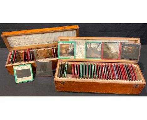 A selection of early 20th century magic lantern slides, black and white, some hand coloured, including Ekoi Ju-Ju attendant S