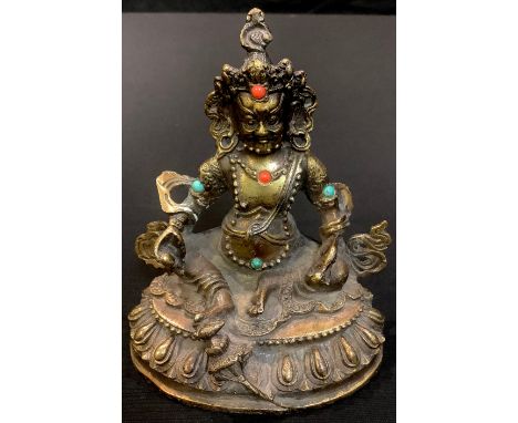 A gilt bronze model of a Deity, inset with coral and turquoise, 12cm high 